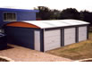 Curved roof garage with 3 roller doors
